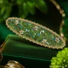 A simple and elegant hair accessory with a white floral hairpin and green crystal accents Specification image